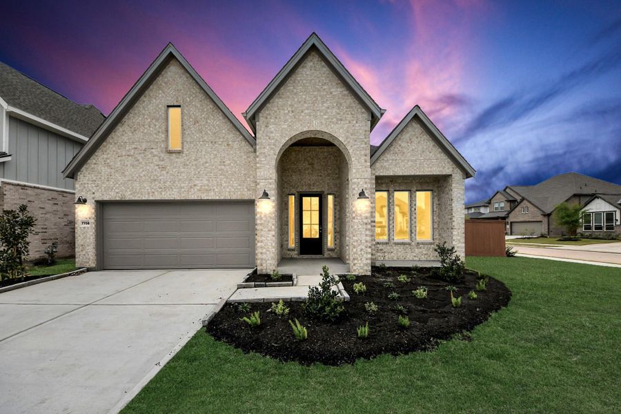 Front exterior of a new home in 50' Traditional Homes at Elyson, Katy, TX, highlighting curb appeal (Image 21). Front exterior of a new home in 50' Traditional Homes at Elyson, Katy, TX, highlighting curb appeal (Image 21).