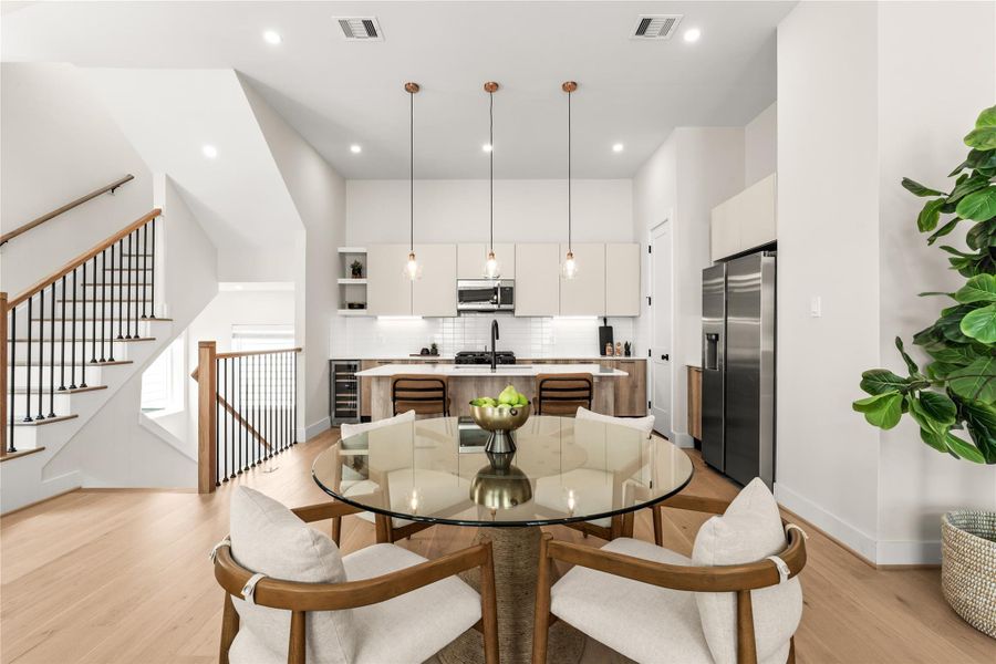 Looking back toward the kitchen shows how the dining area acts as a natural transition between cooking and living spaces.