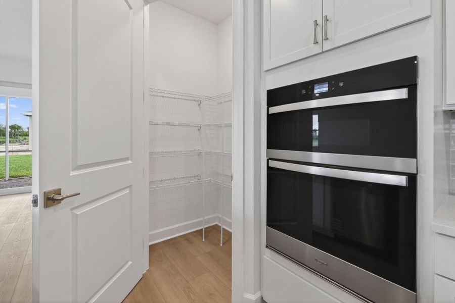 Furnished interior view inside a new home in Del Webb Tradition, Port St. Lucie (Image 54).