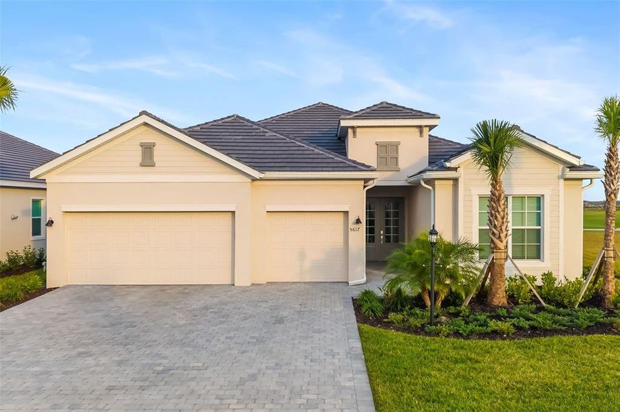 Front exterior of a new home in , Lakewood Ranch, FL, highlighting curb appeal (Image 27).