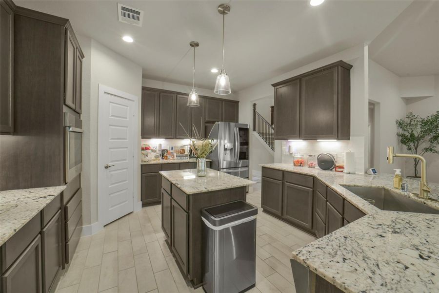 Abundant cabinetry and counter space for meal preparation.