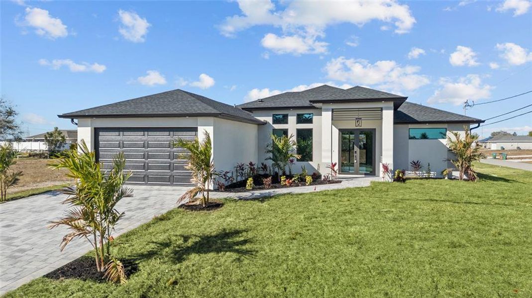 Front exterior of a new home in , Cape Coral, FL, highlighting curb appeal (Image 26). Front exterior of a new home in , Cape Coral, FL, highlighting curb appeal (Image 26).