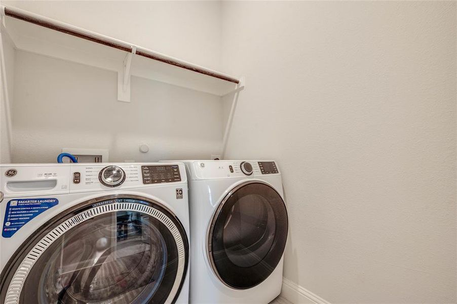 Laundry room conveniently located near primary and 2nd bedrooms.