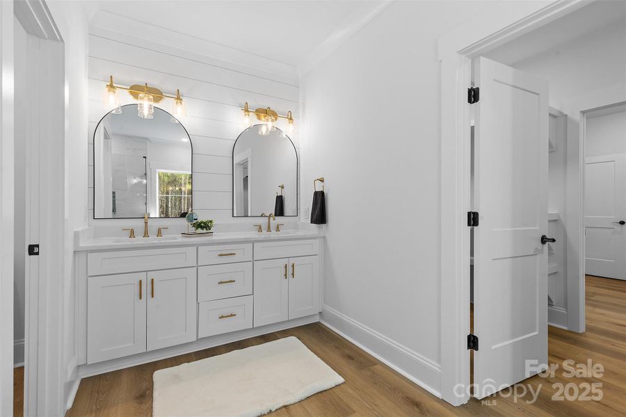 *representative photo- primary ensuite full bath w/ tub, frameless custom tiled shower, separate commode room