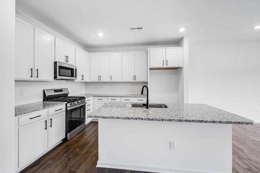 Furnished interior view inside a new home in Magnolia Townes, Wendell (Image 2). Furnished interior view inside a new home in Magnolia Townes, Wendell (Image 2).