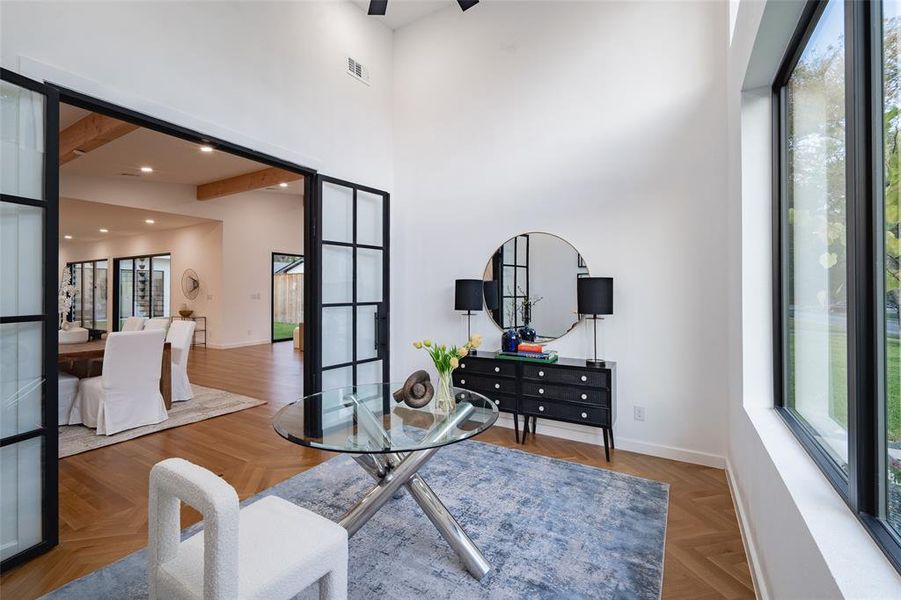 Office with steel framed doors and herringbone floors