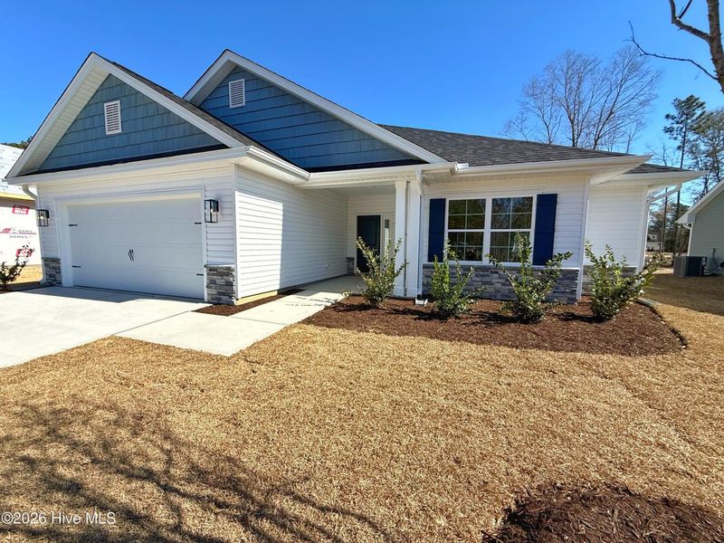 Front exterior of a new home in Wood Creek, Leland, NC, highlighting curb appeal (Image 12).
