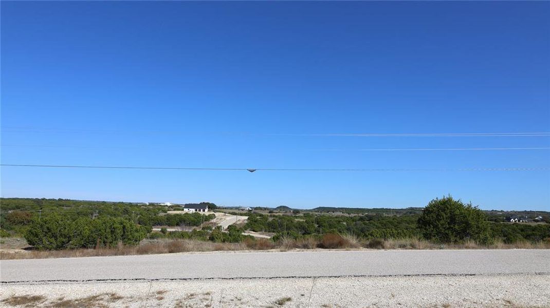 View of asphalt street across the street from property location. View of asphalt street across the street from property location.