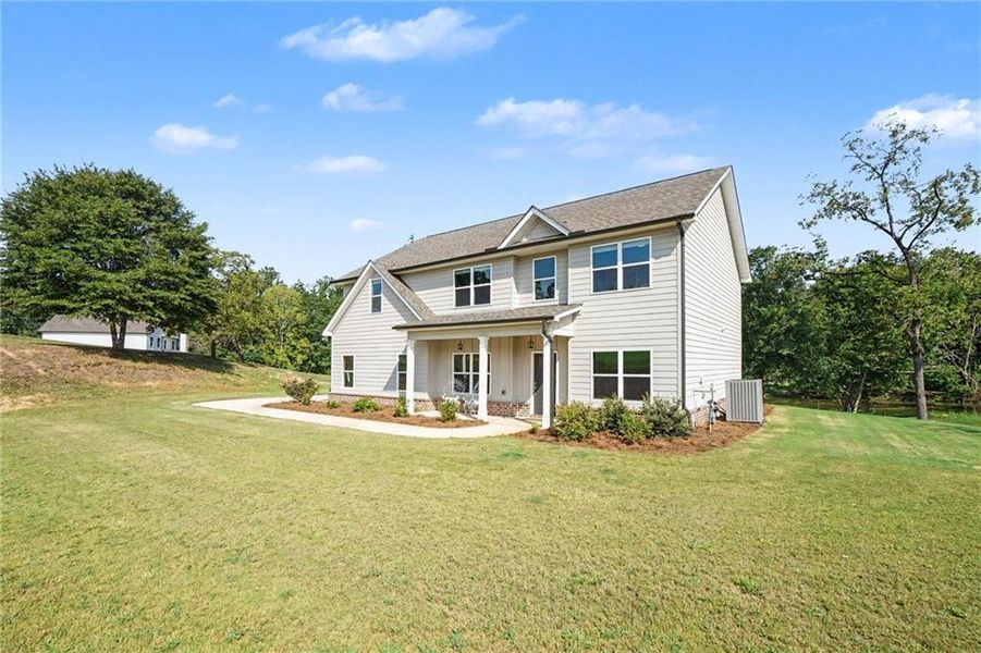 Front exterior of a new home in , Covington, GA, highlighting curb appeal (Image 2). Front exterior of a new home in , Covington, GA, highlighting curb appeal (Image 2).
