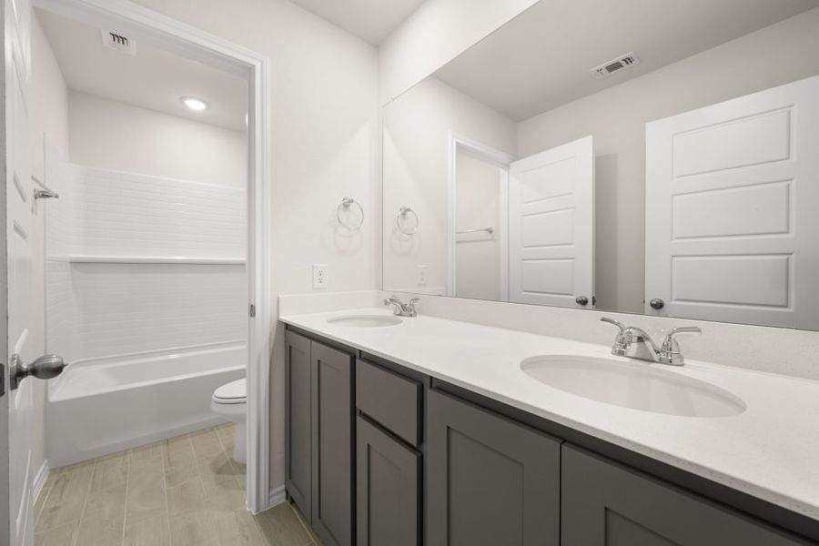 Front exterior of a new home in Myrtle Creek, Waxahachie, TX, highlighting curb appeal (Image 25). Front exterior of a new home in Myrtle Creek, Waxahachie, TX, highlighting curb appeal (Image 25).