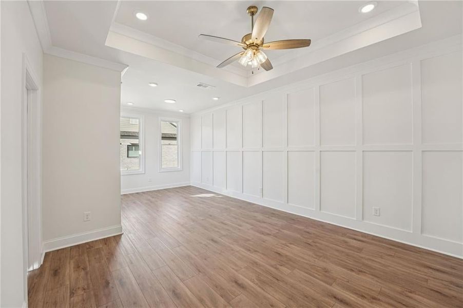 Primary Suite offers plenty of natural light and with Extra LED lights, ceiling fans and tray ceilings and crown molding are included in your primary get away space.  Image is of previously built Chamberlain Plan.