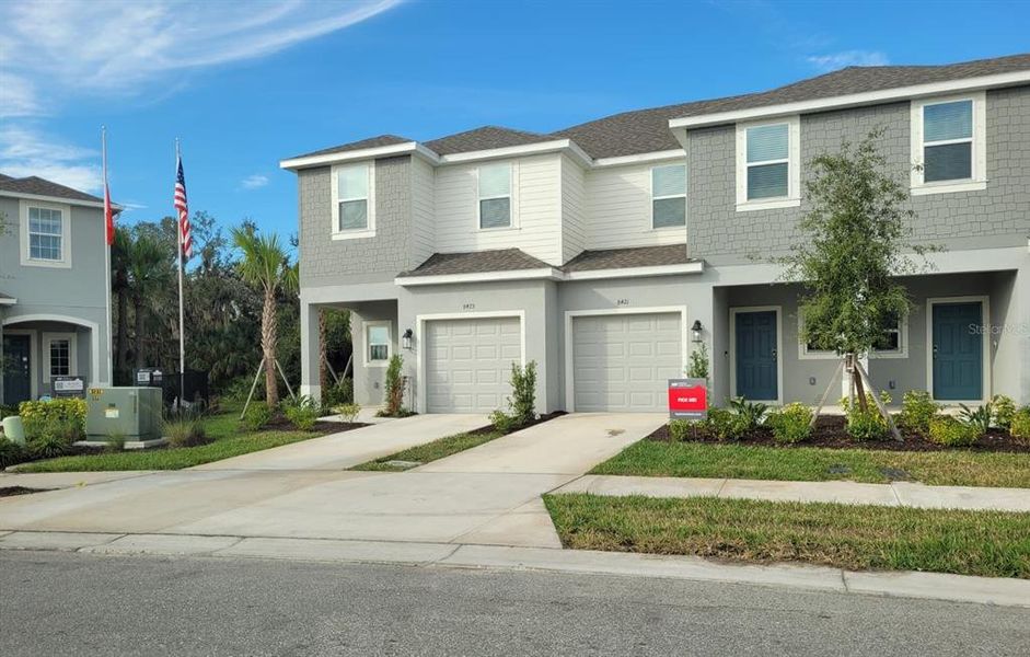 Front exterior of a new home in , Sarasota, FL, highlighting curb appeal (Image 1). Front exterior of a new home in , Sarasota, FL, highlighting curb appeal (Image 1).