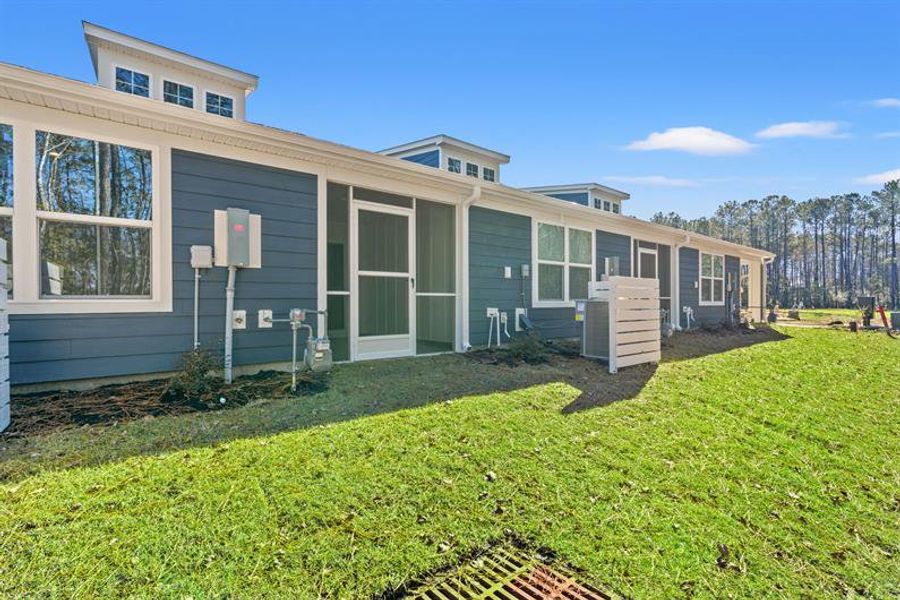 Exterior details and patio area of a home in Course Club at Prince Creek, Murrells Inlet (Image 3).