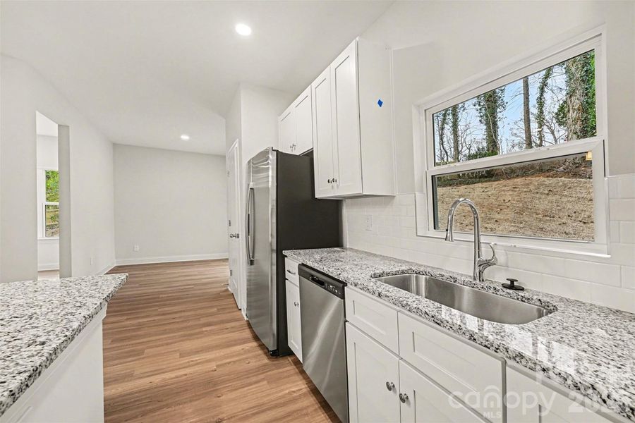Furnished interior view inside a new home in , Newton (Image 17).