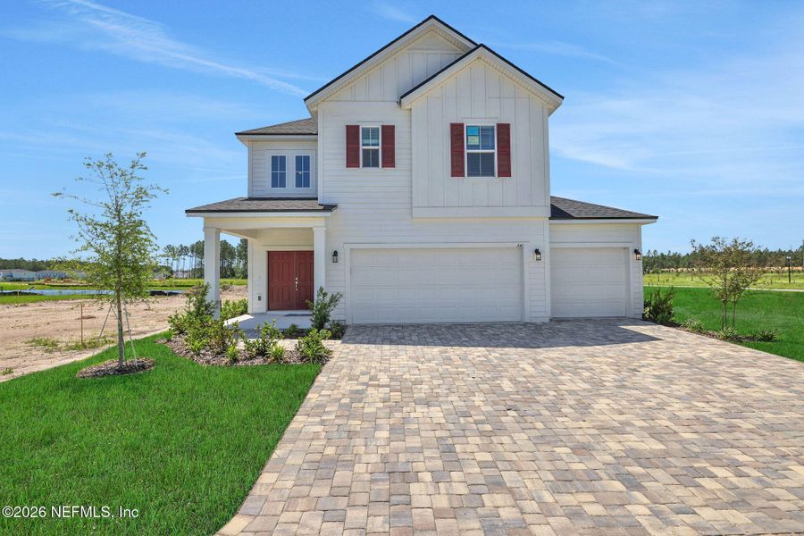 Front exterior of a new home in Brook Forest, St. Augustine, FL, highlighting curb appeal (Image 27).