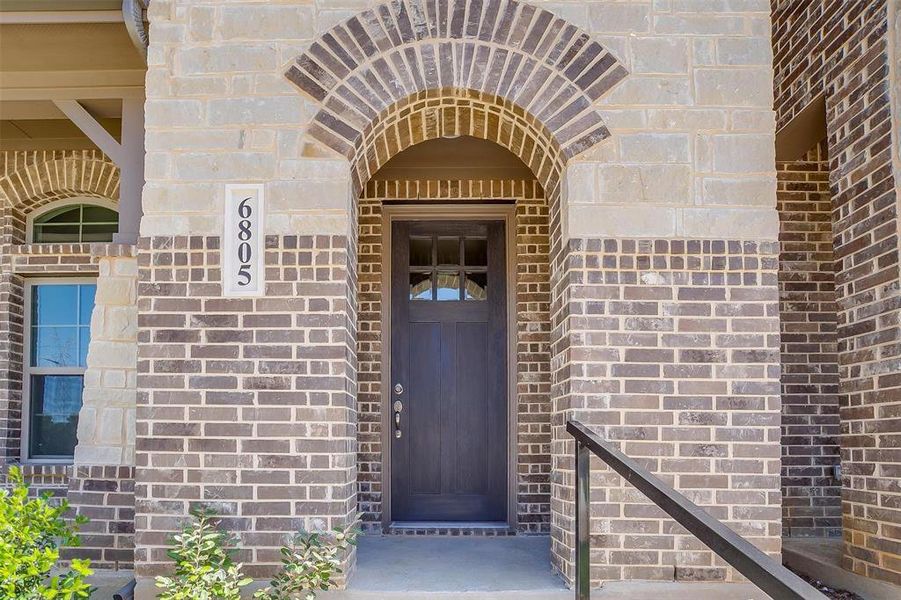 View of exterior entry featuring brick siding View of exterior entry featuring brick siding
