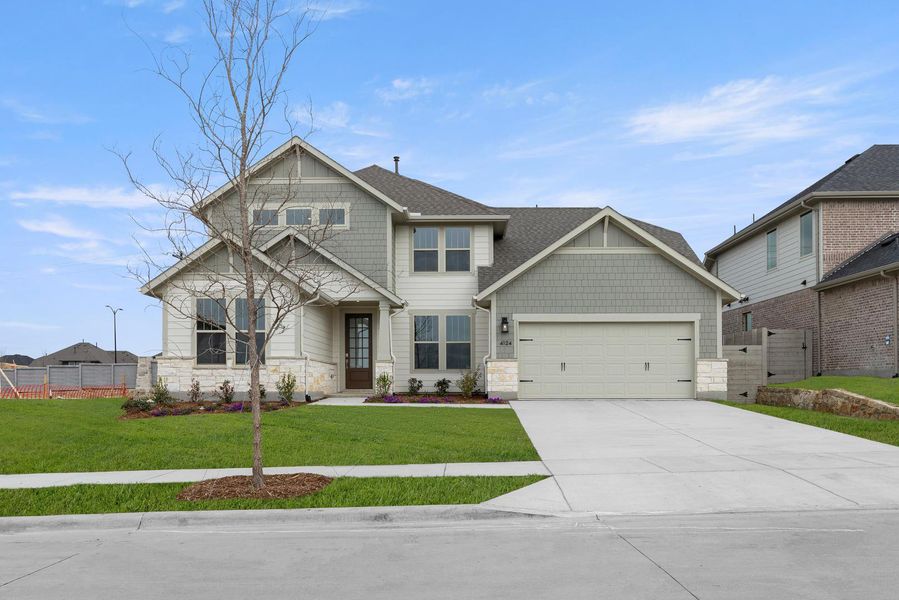 Front exterior of a new home in Painted Tree, McKinney, TX, highlighting curb appeal (Image 1). Front exterior of a new home in Painted Tree, McKinney, TX, highlighting curb appeal (Image 1).