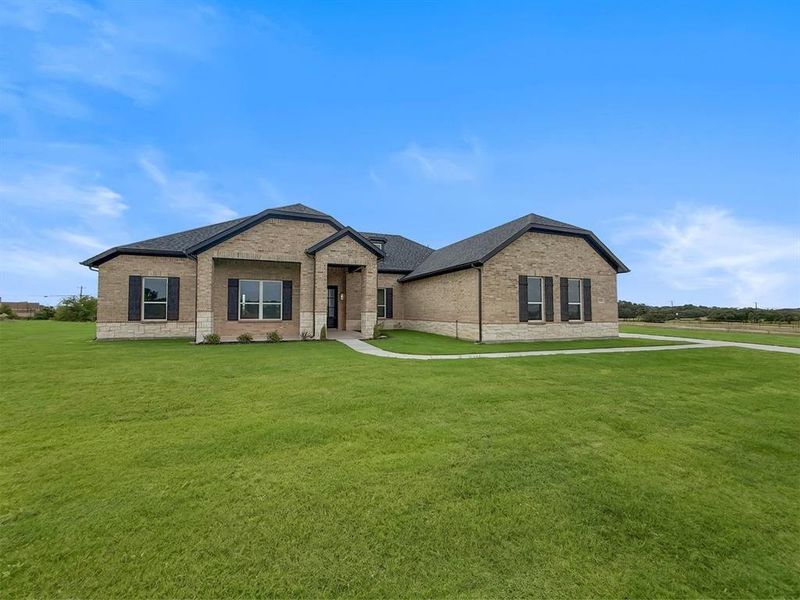 Front exterior of a new home in Calhoun Acres, Azle, TX, highlighting curb appeal (Image 2). Front exterior of a new home in Calhoun Acres, Azle, TX, highlighting curb appeal (Image 2).