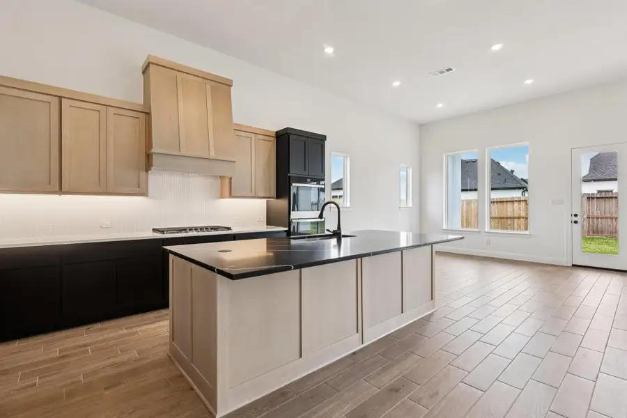 Furnished interior view inside a new home in Sienna 65', Missouri City (Image 11).