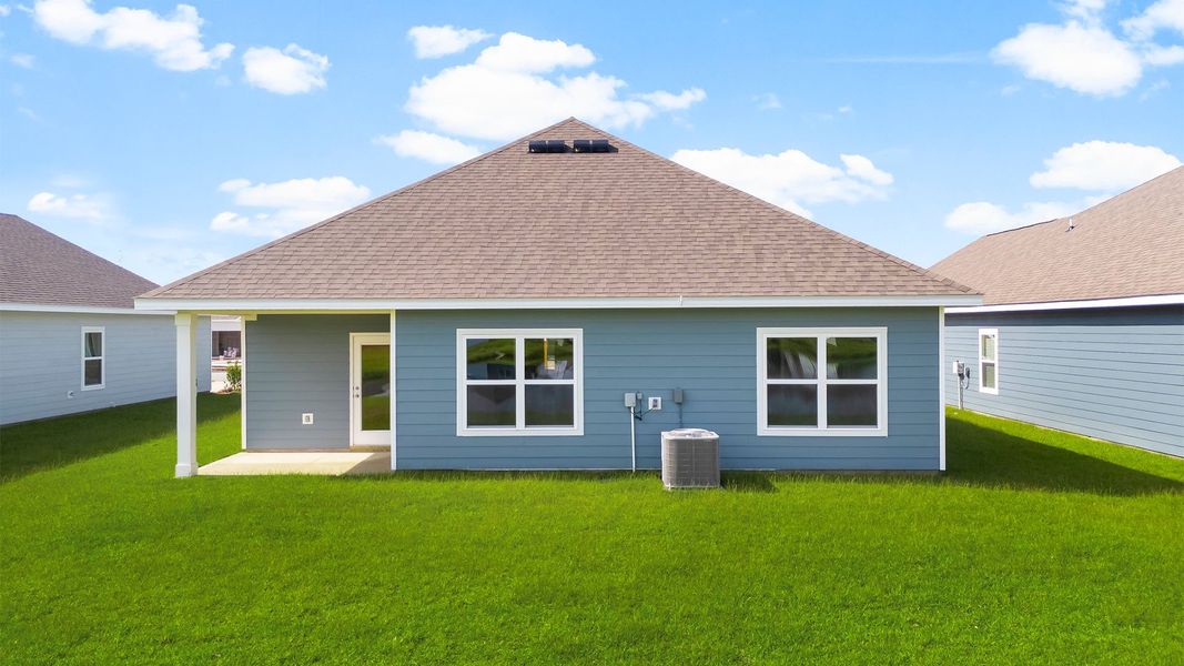 Front exterior of a new home in Hodges Bayou Plantation, Panama City, FL, highlighting curb appeal (Image 17). Front exterior of a new home in Hodges Bayou Plantation, Panama City, FL, highlighting curb appeal (Image 17).