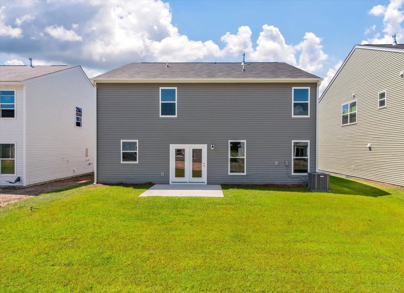 Front exterior of a new home in Oakley Pointe, Moncks Corner, SC, highlighting curb appeal (Image 1).