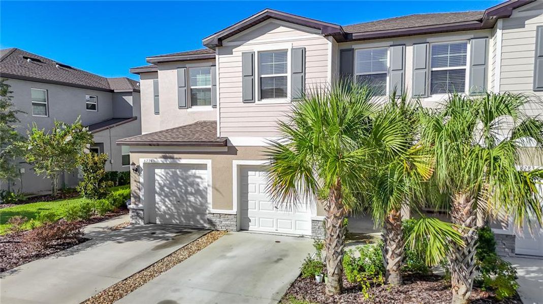 Front exterior of a new home in , Land O' Lakes, FL, highlighting curb appeal (Image 26).