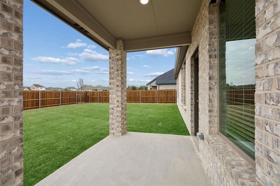 Covered Patio in the Masters home plan by Trophy Signature Homes – REPRESENTATIVE PHOTO