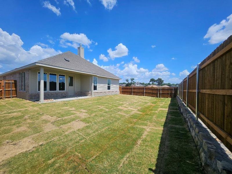 Exterior details and patio area of a home in The Hollow, Ennis (Image 3).