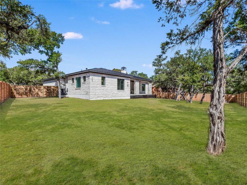 View of yard with a fenced backyard