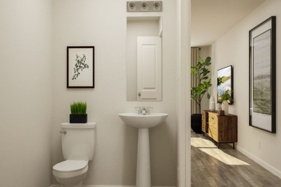 A bathroom with a sink and toilet. A bathroom with a sink and toilet.