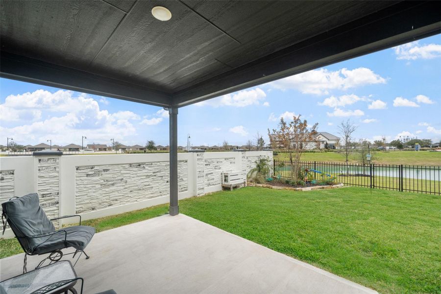 Covered back porch is a great spot to relax, have flower pots, grill and entertain.