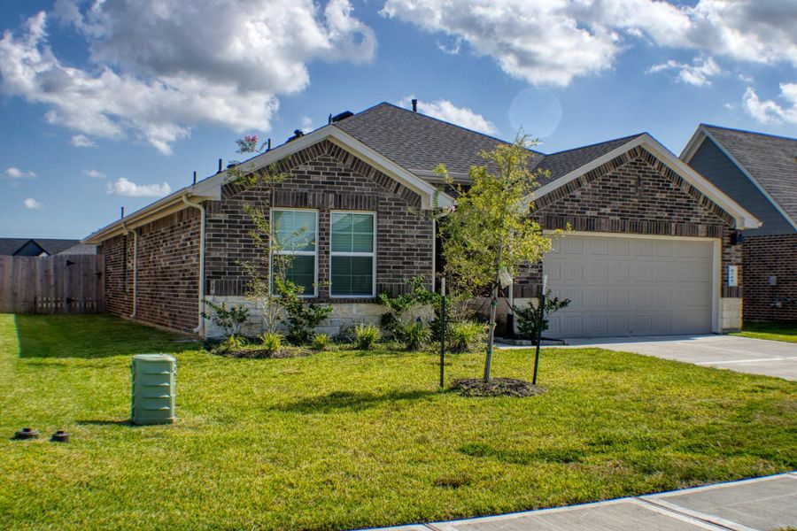 Front exterior of a new home in Central Park, Texas City, TX, highlighting curb appeal (Image 16). Front exterior of a new home in Central Park, Texas City, TX, highlighting curb appeal (Image 16).