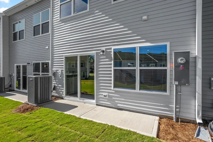 Exterior details and patio area of a home in West Main Townhomes, Sanford (Image 2). Exterior details and patio area of a home in West Main Townhomes, Sanford (Image 2).