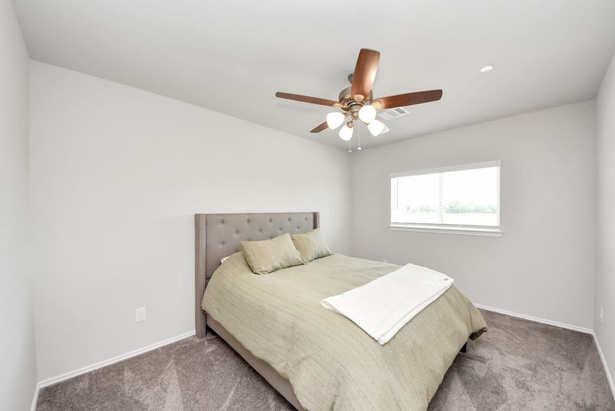 View of bedroom #2 located upstairs. Light and bright room with ceiling fan with light. Very spacious room! View of bedroom #2 located upstairs. Light and bright room with ceiling fan with light. Very spacious room!