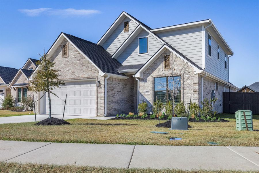 Front exterior of a new home in , Bryan, TX, highlighting curb appeal (Image 25).