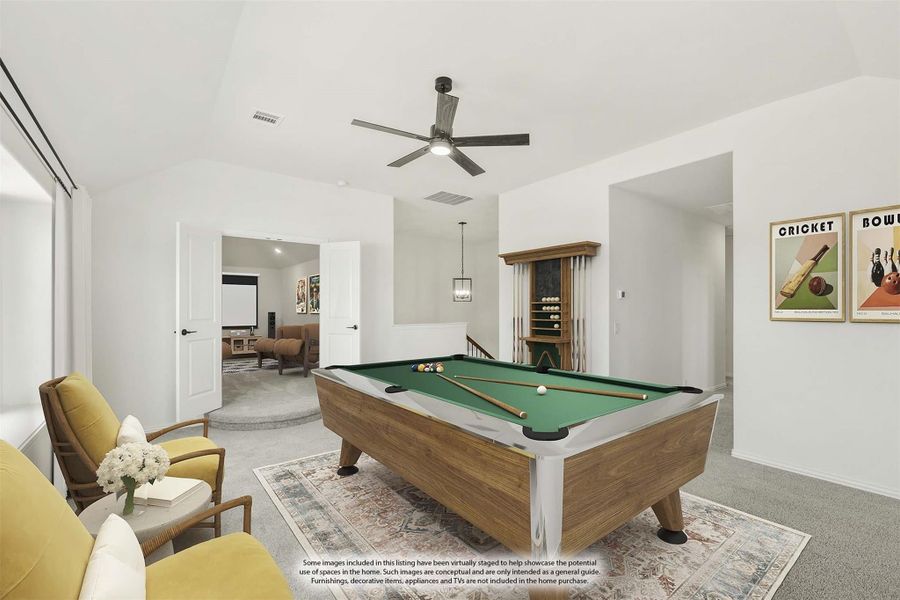 Game room with wood pool table, ceiling fan, and open doorway to media room Game room with wood pool table, ceiling fan, and open doorway to media room