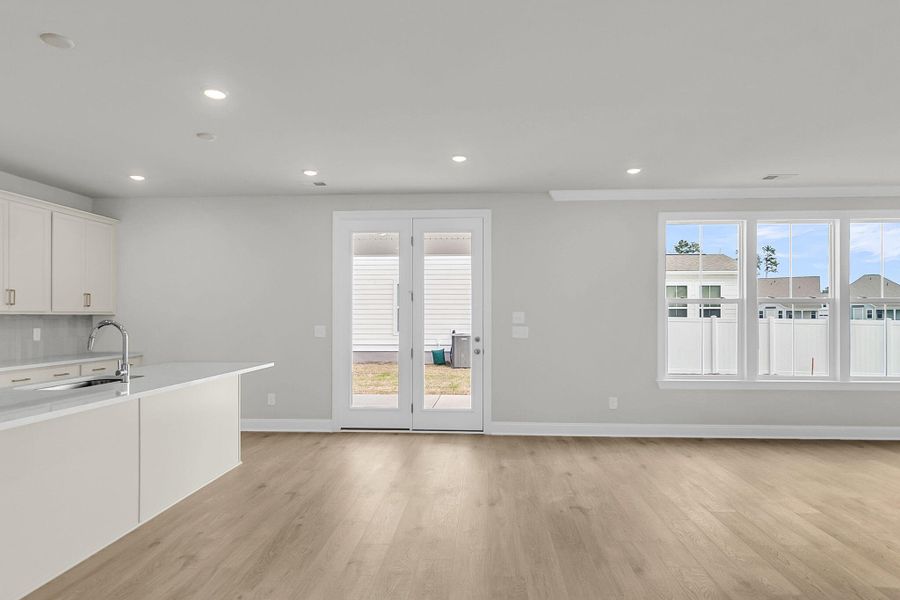 Spacious, unfurnished interior of a new home in Tidewater at Lakes of Cane Bay, Summerville (Image 38).