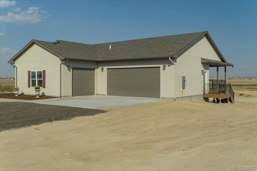 Front exterior of a new home in , Pueblo West, CO, highlighting curb appeal (Image 26).