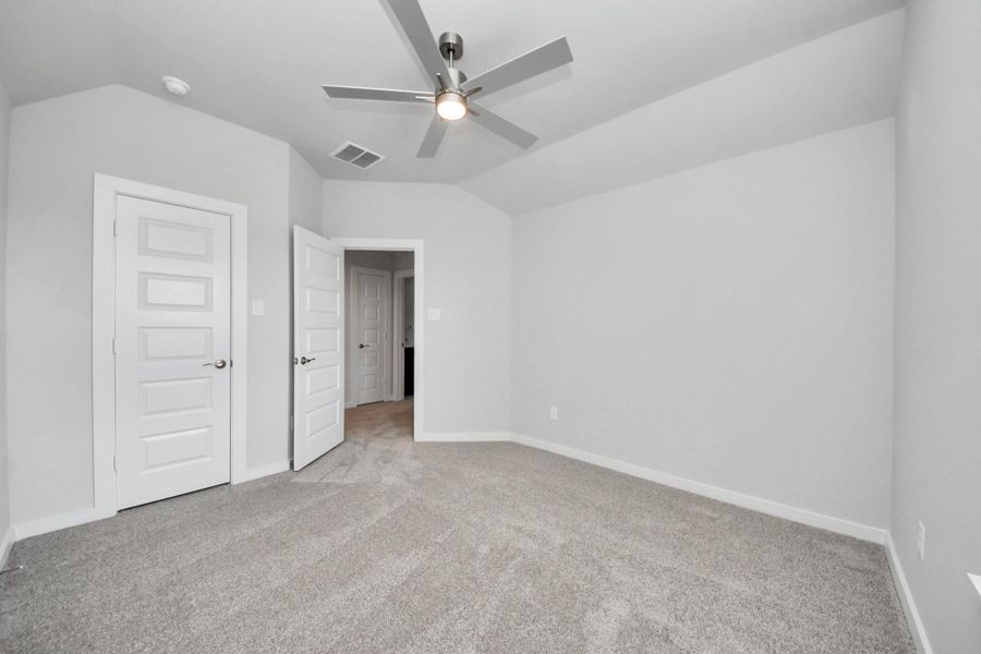 Generously sized secondary bedrooms featuring spacious closets, soft and inviting carpeting underfoot, large windows allowing plenty of natural light, and the added touch of privacy blinds for your personal retreat.