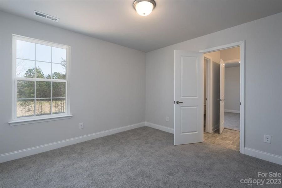 Representative unfurnished interior of a home built from the 3119 by Adams Homes in Hidden Pines, Cameron (Image 25).