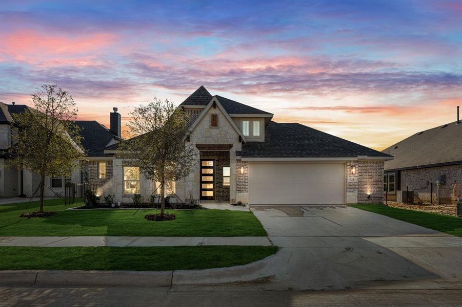 Front exterior of a new home in Abe's Landing, Granbury, TX, highlighting curb appeal (Image 2). Front exterior of a new home in Abe's Landing, Granbury, TX, highlighting curb appeal (Image 2).
