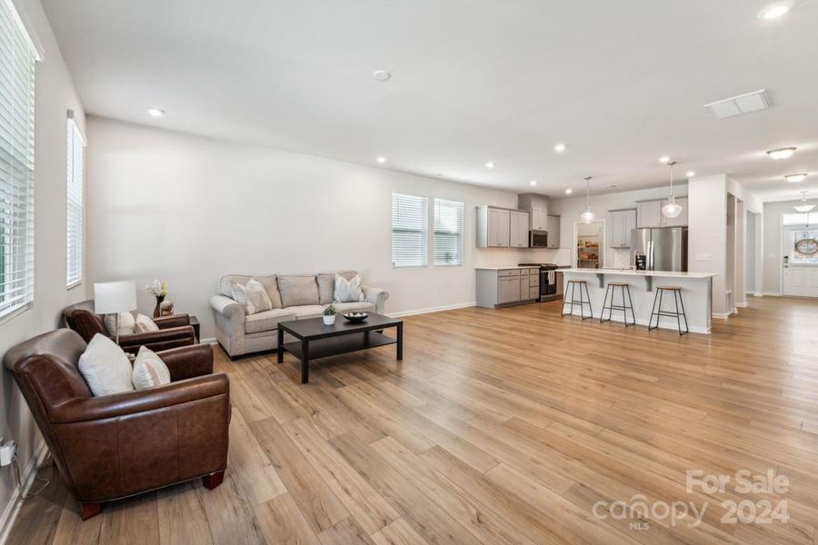 Living room, dining area, kitchen and foyer