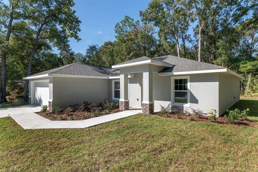 Front exterior of a new home in , Dunnellon, FL, highlighting curb appeal (Image 25). Front exterior of a new home in , Dunnellon, FL, highlighting curb appeal (Image 25).