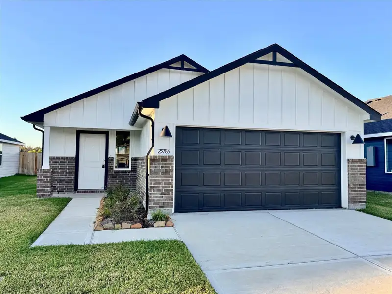 Front exterior of a home in the Hill & Dale Ranch community, located in Splendora, TX (Image 22).