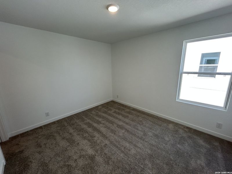 Spacious, unfurnished interior of a new home in Hennersby Hollow, San Antonio (Image 31).