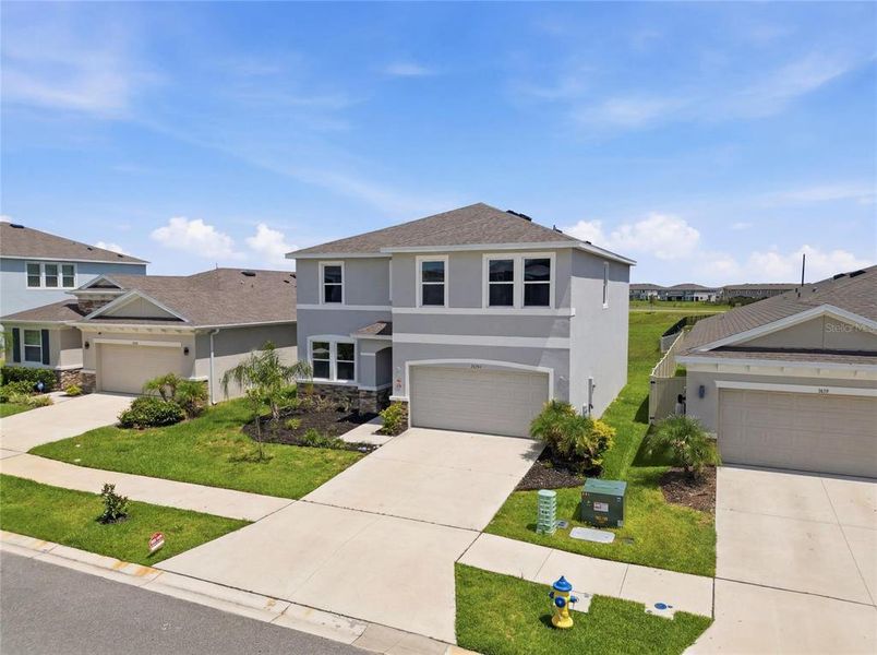 Front exterior of a new home in Epperson, Wesley Chapel, FL, highlighting curb appeal (Image 25). Front exterior of a new home in Epperson, Wesley Chapel, FL, highlighting curb appeal (Image 25).