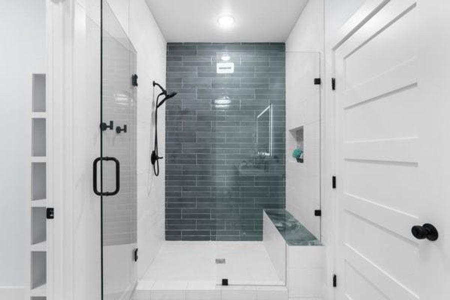 Bathroom featuring a stall shower Bathroom featuring a stall shower