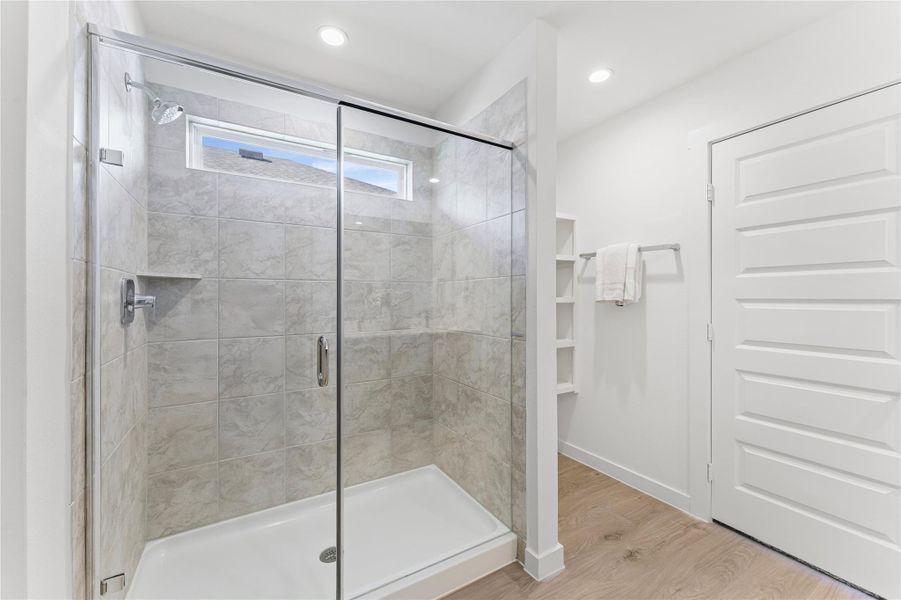 The oversized shower provides a sleek, modern touch, perfect for unwinding after a long day in the Sorrento sun.