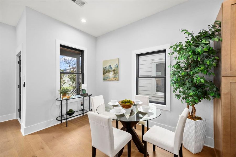 Bright and inviting dining area. Large windows for natural lighting.