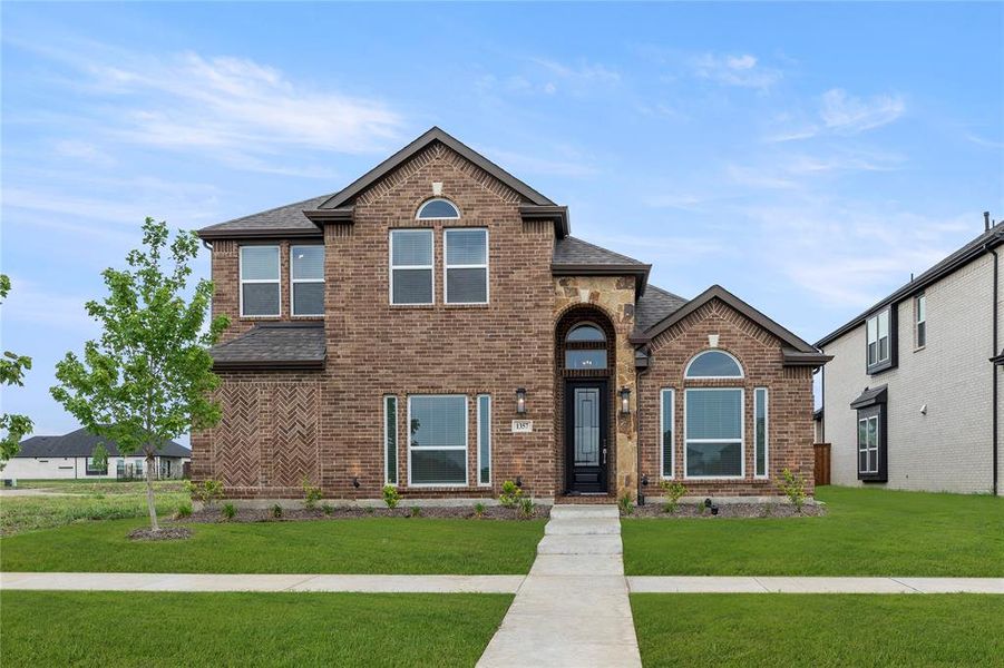 Front exterior of a new home in Villages of Creekwood, Frisco, TX, highlighting curb appeal (Image 2). Front exterior of a new home in Villages of Creekwood, Frisco, TX, highlighting curb appeal (Image 2).
